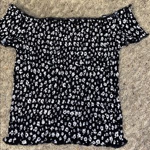 A brand new black shirt with white flowers